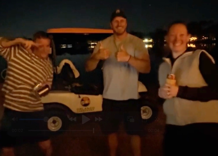 Friends socializing under palm trees at Orlando’s lakefront tiny home community Friends socializing under palm trees at Orlando’s lakefront tiny home community