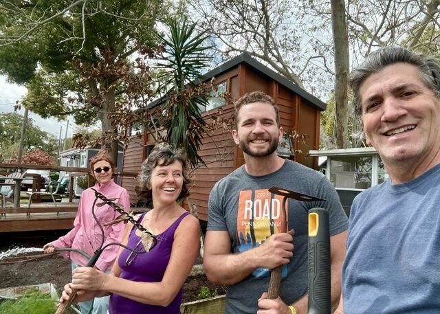 Community members building raised garden beds at Tiny Town Orlando community garden Community members building raised garden beds at Tiny Town Orlando community garden