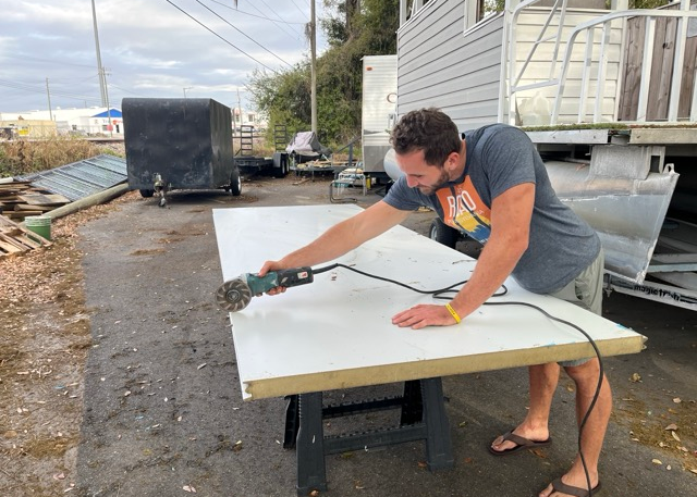 Cutting materials for raised garden construction at Tiny Town Orlando Cutting materials for raised garden construction at Tiny Town Orlando