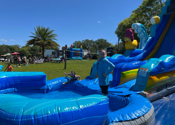 Inflatable water slide at outdoor community event Orlando Inflatable water slide at outdoor community event Orlando