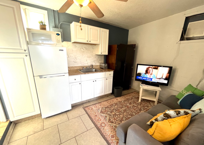 Tiny studio kitchenette white cabinets hex tile backsplash Orlando Tiny studio kitchenette white cabinets hex tile backsplash Orlando