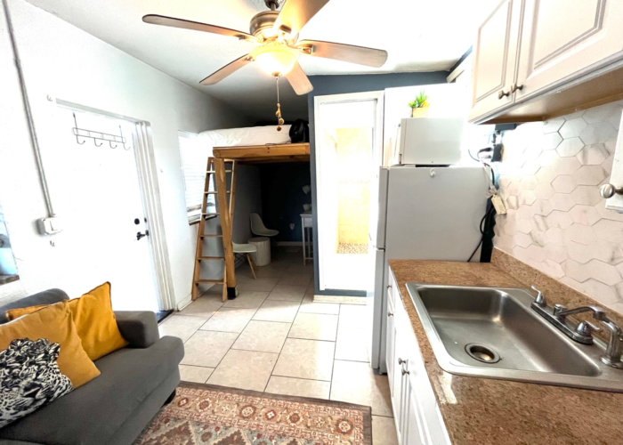 Tiny studio kitchenette white cabinets hex tile backsplash Orlando Tiny studio kitchenette white cabinets hex tile backsplash Orlando