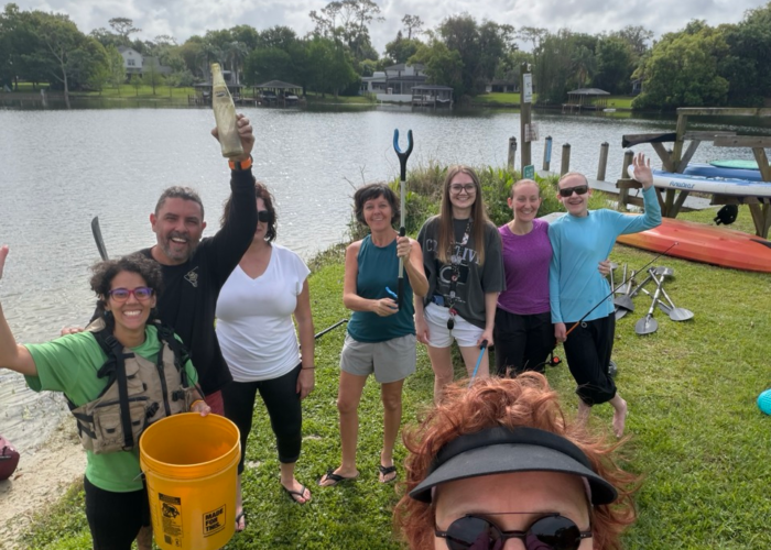 Tiny Town Orlando residents enjoying lakefront community living near Lake Fairview with outdoor social gathering Tiny Town Orlando residents enjoying lakefront community living near Lake Fairview with outdoor social gathering