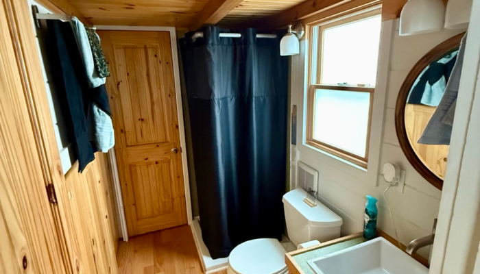 Affordable tiny house in Orlando with full bathroom and rustic wood interior inside The Dragonfly tiny home Affordable tiny house in Orlando with full bathroom and rustic wood interior inside The Dragonfly tiny home