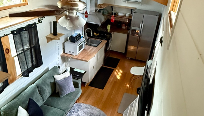 Affordable tiny house in Orlando with open-concept living room and full kitchen inside The Dragonfly tiny home Affordable tiny house in Orlando with open-concept living room and full kitchen inside The Dragonfly tiny home