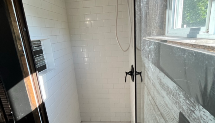 Walk-in shower and full size toilet in tiny house rental Walk-in shower and full size toilet in tiny house rental
